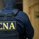 OFICIAL // Un avocat și un angajat al unei instanțe din Chișinău, reținuți de CNA și PA într-un dosar de trafic de influență