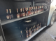 Zeci de sticle de alcool, descoperite de vameșii români ascunse într-un autocar care venea din Republica Moldova
